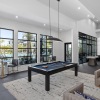 clubroom with pool deck and ample natural light