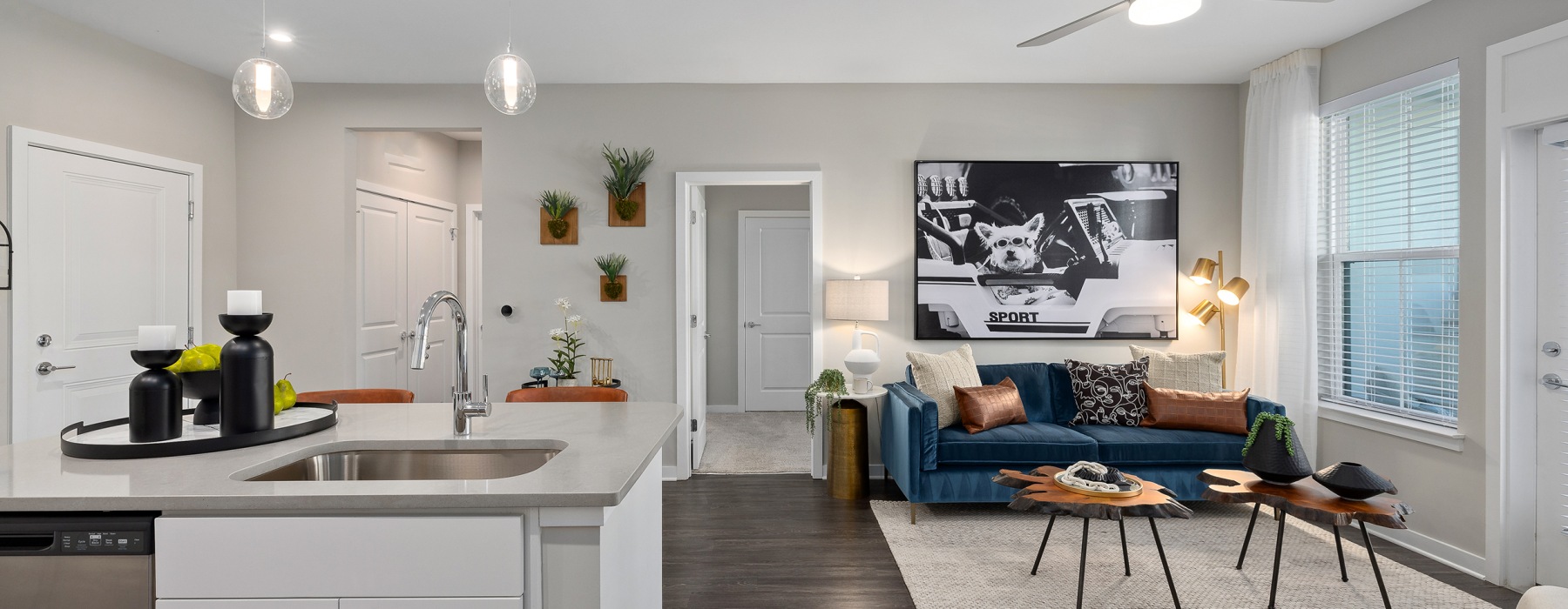 Living room with lounge seating and a kitchen island 